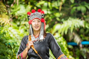 Hmong woman wearing traditional attire with headpiece