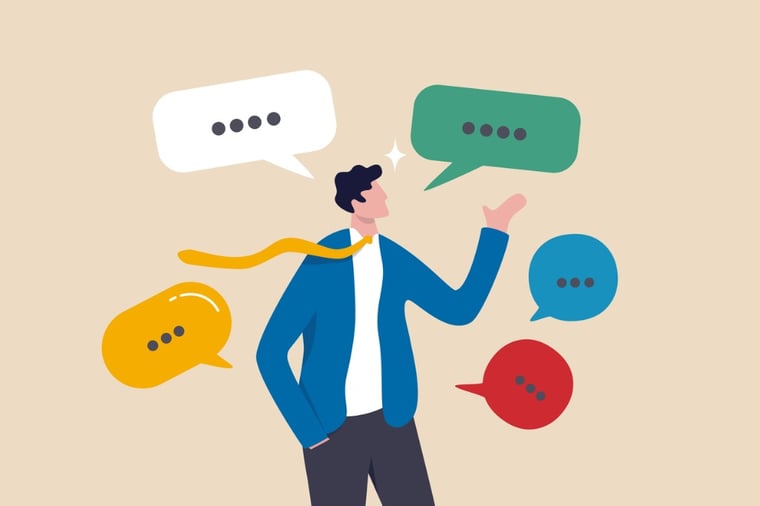 Man with tie juggling colorful speech bubbles, communication concept