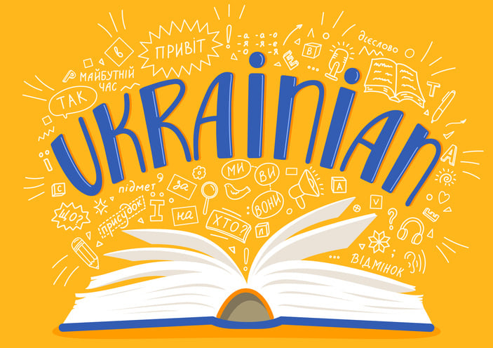 cartoon book opened with Ukrainian phrases indicating translations to English